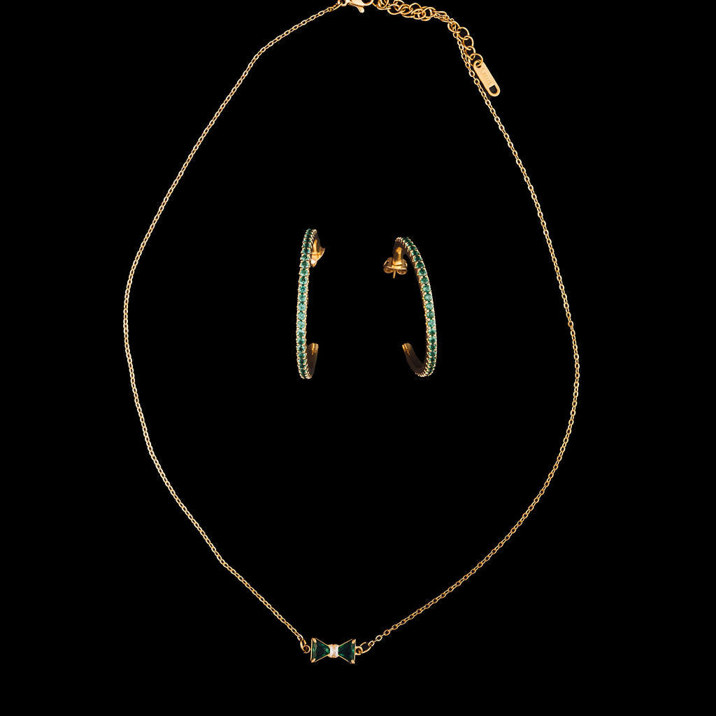 Jewelry set with necklace and earrings on a black background