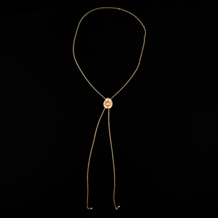 30-inch gold bolo tie necklace with cowboy hat and glass stone detail